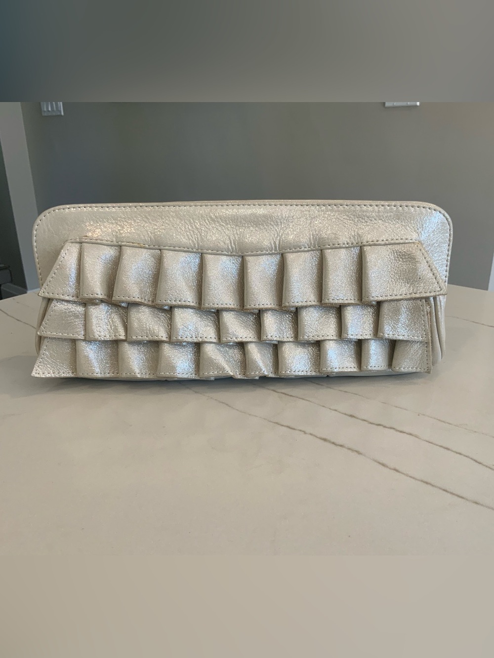 TREESJE Metallic Gold Ruffled Leather Clutch